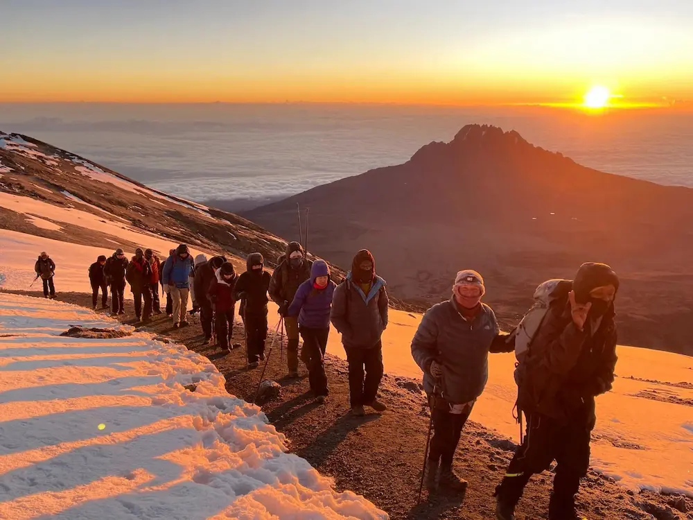 Hikers on a steep high-altitude path