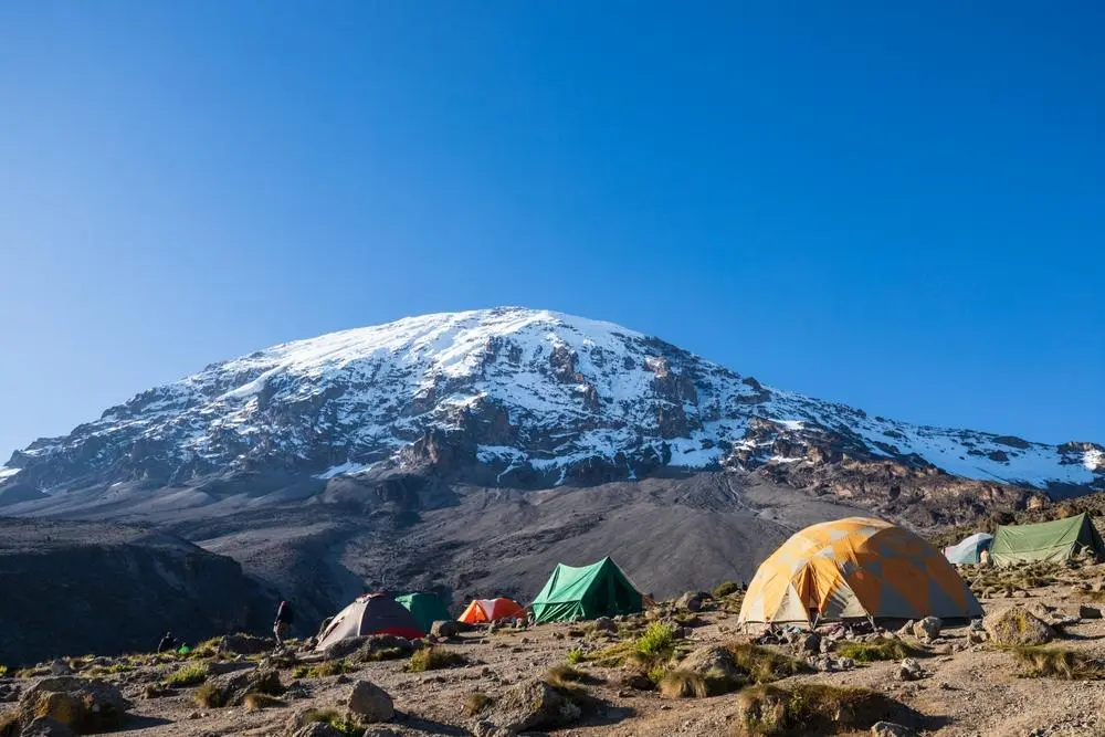 Trekkers walking between mountain camps