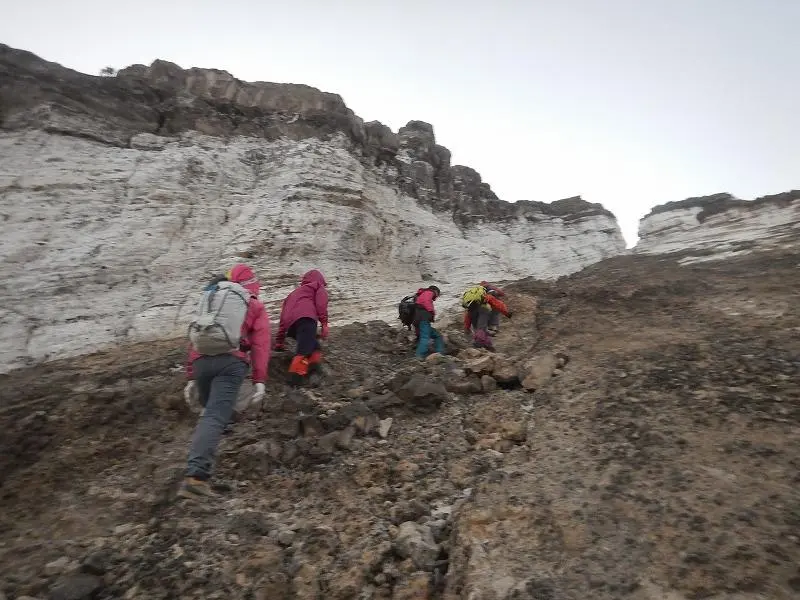 Local guide leading climbers on the volcano